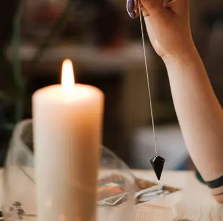 A person holding onto a candle string