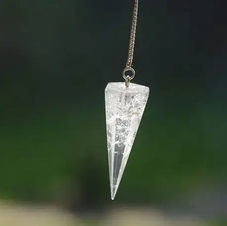 A clear glass hanging decoration with flowers on it.