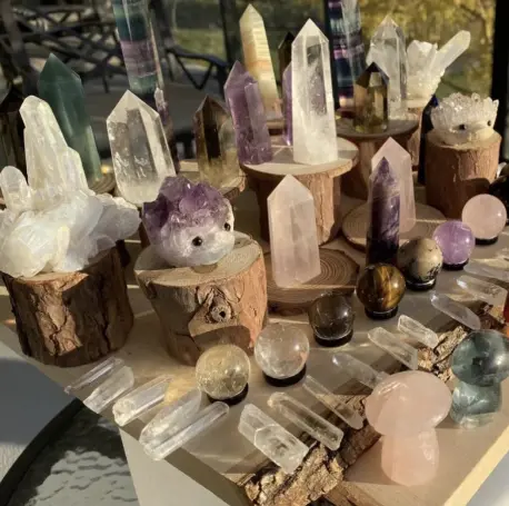 A table with many different types of crystals on it.